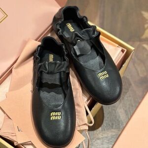 Miu Miu Black Leather Ruffle-Trim Ballet Flats with Gold Logo
